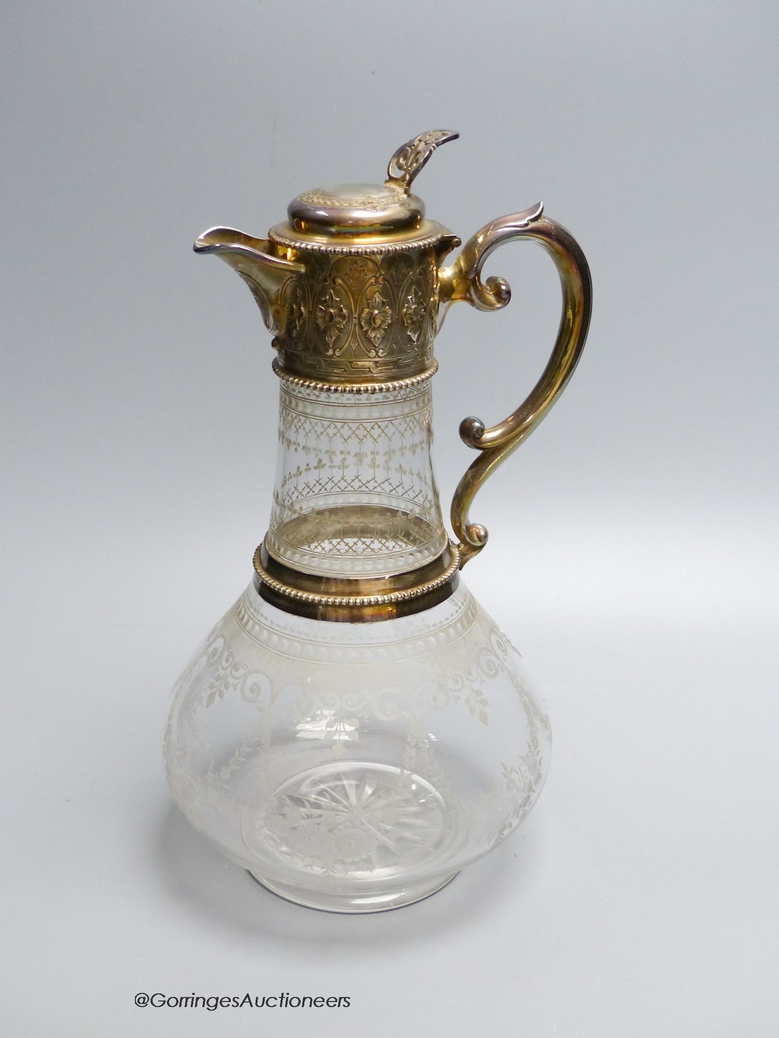 A Victorian silver mounted wheel engraved glass claret jug, by W & G Sissons, Sheffield 1868, 28 cm high